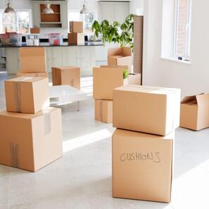 Moving card board boxes with kitchen in background